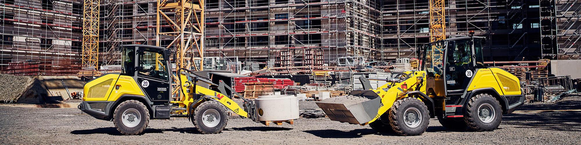 Wacker Neuson WL750p and WL950p performance wheel loaders in operation on a construction site.